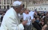 A kid dressed like Pope gets the Papal blessing